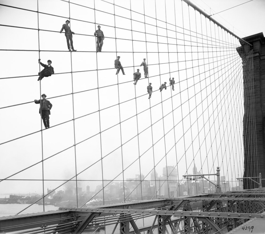 This group of workers suspended from the cables of the Brooklyn Bridge in 1914.