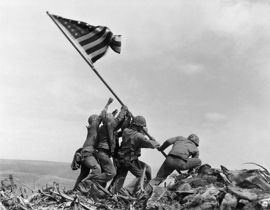 U.S. military raising the American flag on Iwo Jima in February, 1945.
